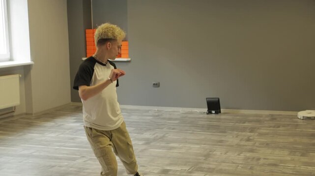 Young energetic man performing contemporary dance routine