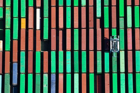 Top down view of colorful shipping containers at a commercial port
