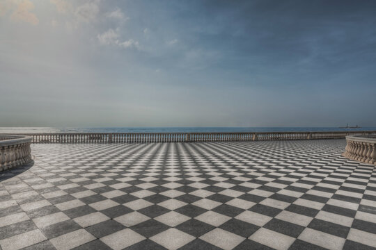 View of the iconic checkered floor of Terrazza Mascagni overlooking the Mediterranean Sea in Livorno, Tuscany, Italy.