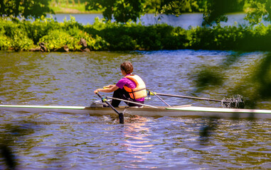 A girl are sailing on a rowing boat  © licvin