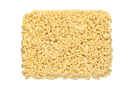 Dried instant noodles block isolated, a common quick meal ingredient. Transparent PNG image.