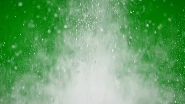 White powder explosion on green screen, abstract dust cloud effect for compositing