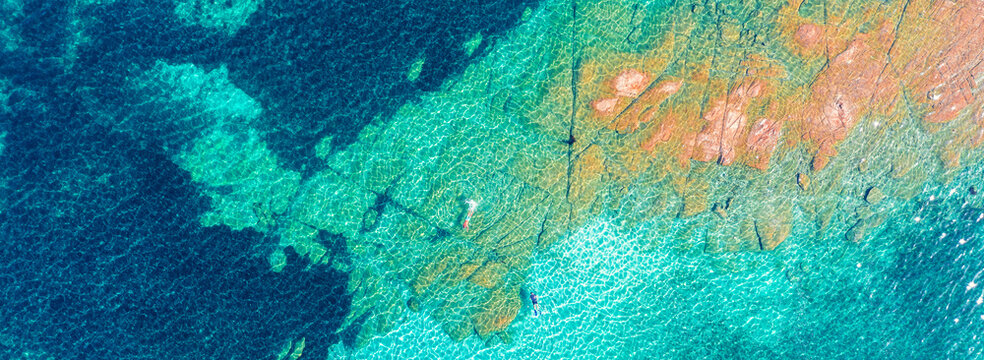 Top view of the sea and island. Sea surface. The texture of water and rocks