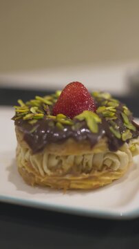 Gourmet Paris-Brest choux pastry filled with cream and fresh strawberries