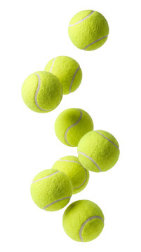 Many tennis balls falling down isolated on transparent background