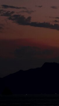 Timelapse night view World Heritage Miyajima fading into the pink sunset,island,Vertical