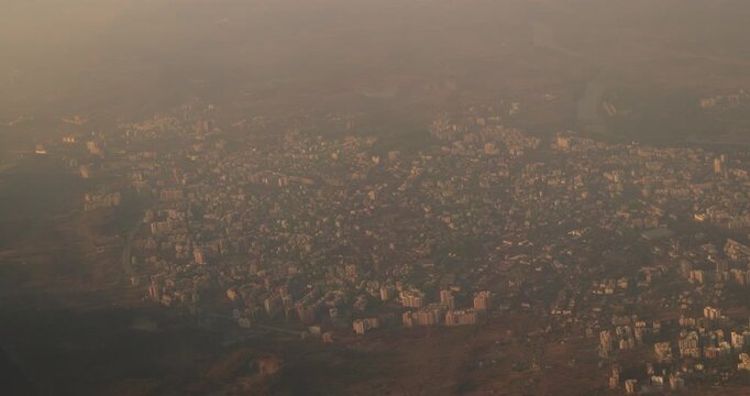 Ulhas river, Mumbai, India. Badlapur is a city in Thane district, Maharashtra state, India, and is a part of Mumbai Metropolitan Region. Aerial View From Airplane Window On View of the Mumbai suburb