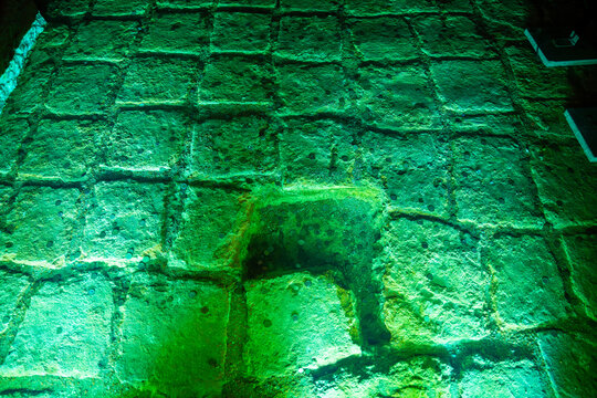  Ancient underground Basilica Cistern in Istanbul with stone columns and illuminated green water reflecting the architecture in a historical setting