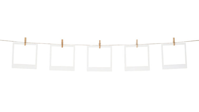 Empty photo frames hanging on a string isolated on transparent background