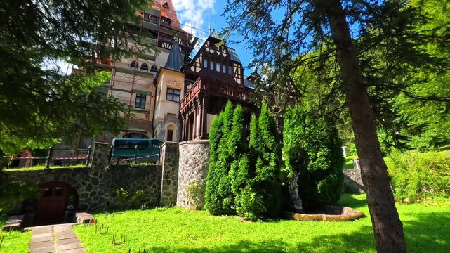 Historic Ornate European Residence Under Restoration With Extensive Scaffolding Along the Facade, Sinaia, Romania - TILT UP VIDEO - NO AUDIO