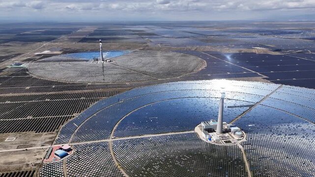 aerial view of large scale parabolic trough solar power plant