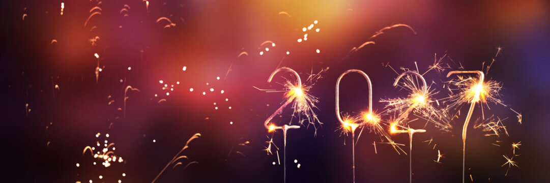 sparkler number 2027 happy new year countdown isolated on blurred abstract fireworks background with copy space, new years eve greeting card banner concept