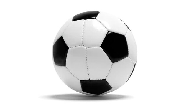 Black and white soccer ball spinning on white background close up static studio shot sports equipment