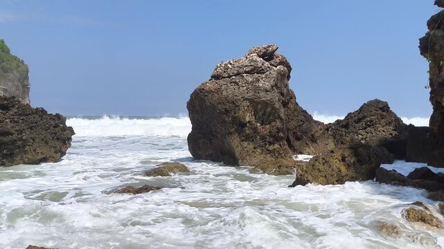 Rugged rocks stand firm against crashing ocean waves