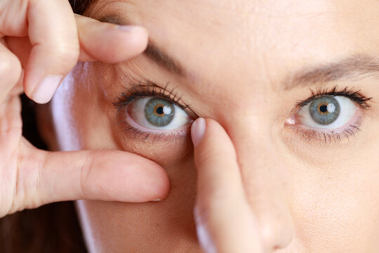 Woman checking her eye
