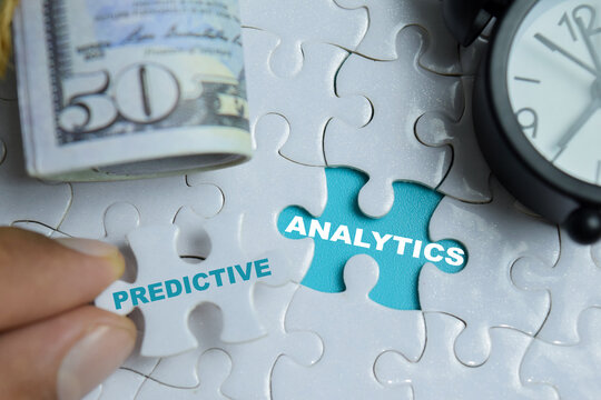 Piece of jigsaw puzzle predictive analytics phrase. For financial forecasting and big data planning