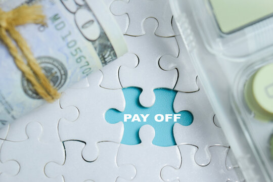 Piece of jigsaw puzzle pay off phrase. For financial debt freedom and investment solution