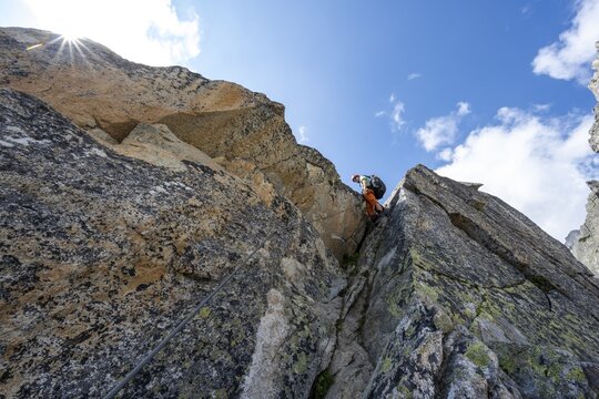 Mountaineers on steep rock face in the secured via ferrata Crocodile Mountain Lake at Bergseeschijen-Vorbau, Sonnenstern, G&ouml;scheneralp, Canton of Uri, Switzerland