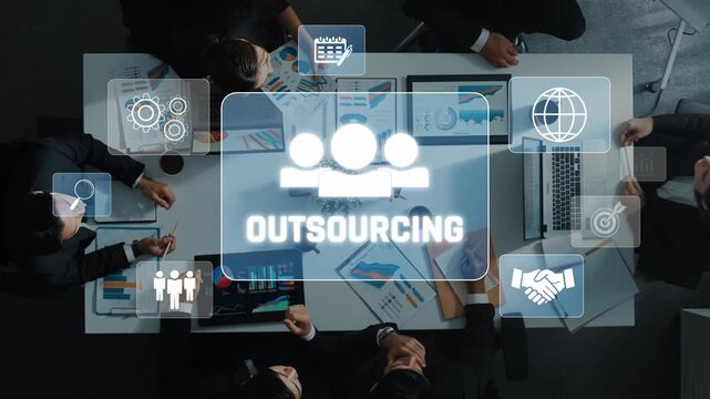 A group of professionals collaborates in a modern office, discussing outsourcing strategies with visual icons for communication, planning, and efficiency. Raster