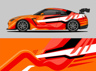 Fototapeta premium Orange and white racing car with dynamic stripe design.