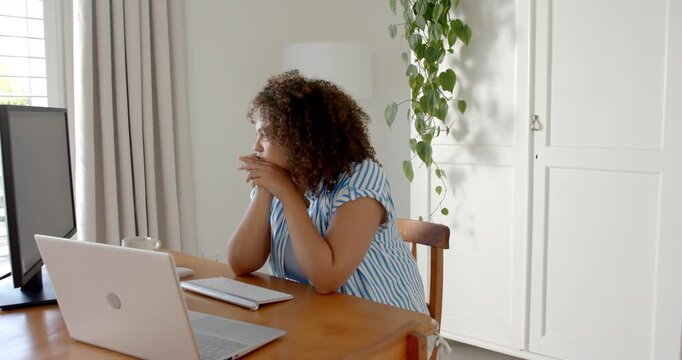 Lifestyle videos indoor of people doing activities at home, stretching at desk, woman working on lap