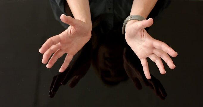 Close up of people talking to the camera, gesturing with hands, person wearing watch