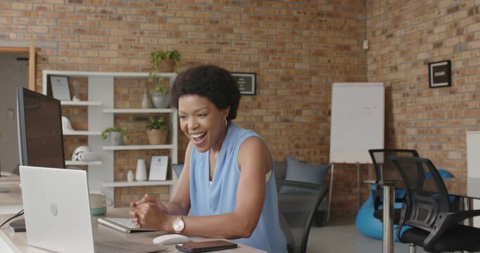 Lifestyle videos indoor of people doing activities at office, laughing woman sitting at desk using c