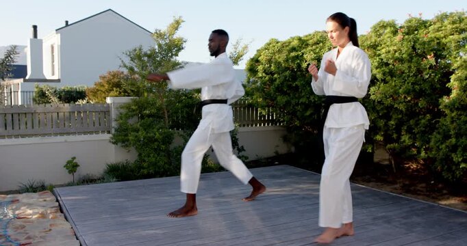 Lifestyle videos outdoor of people doing activities, practicing martial arts, man and woman in karat