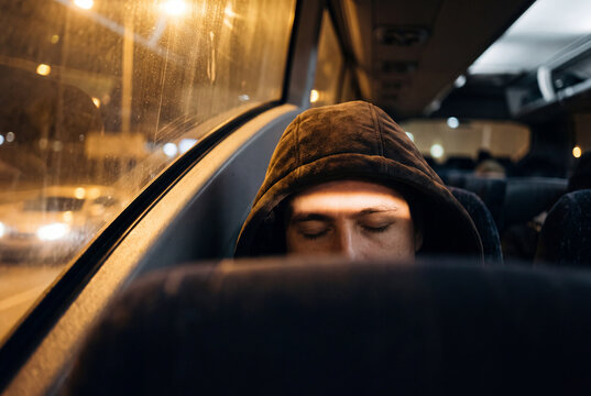 Sleeping Bus Passenger Resting on a Night Coach Journey