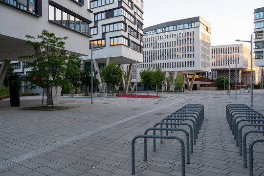 Open plaza with bike racks and modern buildings in Nordbahnviertel Vienna Austria showing contemporary public space in an urban district