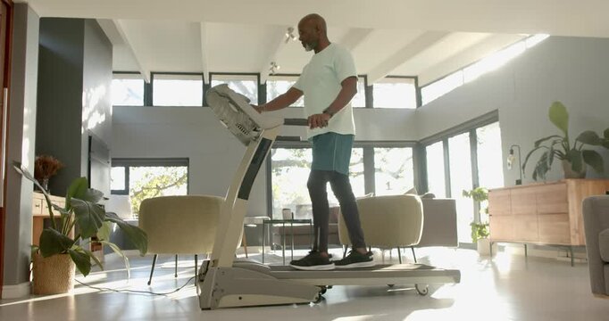Lifestyle videos indoor of people doing activities at home, exercising on treadmill, man staying act