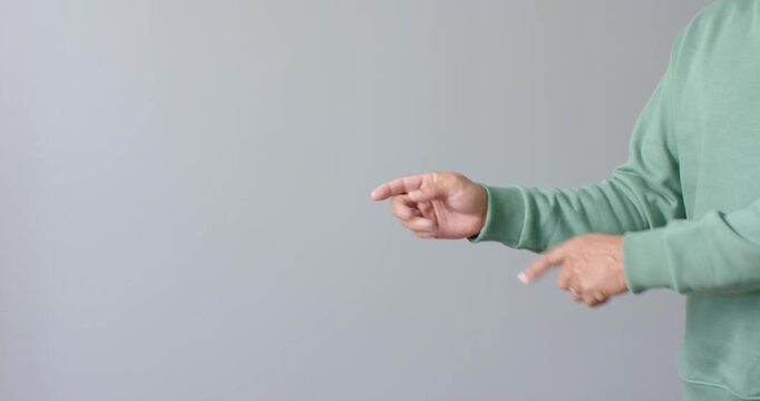 Close up of people talking to the camera, pointing with finger, person in green sweater gesturing ag