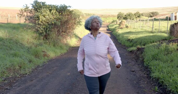 Lifestyle videos outdoor of people doing activities, walking outdoors, elderly woman enjoying nature