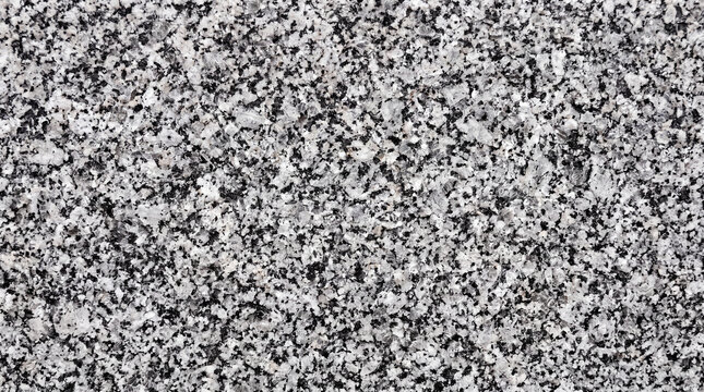 Granite Texture Background: A detailed close-up reveals the speckled, crystalline texture of grey and black granite, offering a robust and versatile surface material.