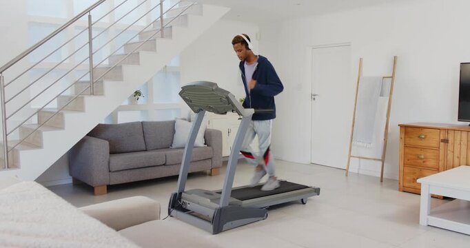 Lifestyle videos indoor of people doing activities at home, running on treadmill at home, man with h