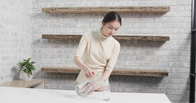 Lifestyle videos indoor of people doing activities at office, woman in casual attire in modern kitch