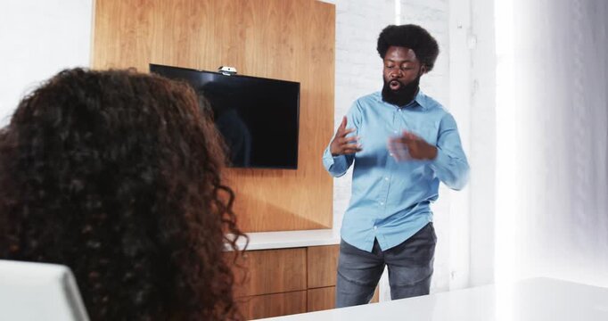 Lifestyle videos indoor of people doing activities at office, presenting ideas, man in blue shirt sp