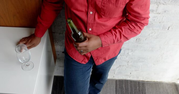 Lifestyle videos indoor of people doing activities at office, holding beer bottle and glass, man in