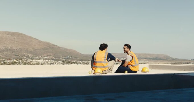 Men, builder or lunch break with high five on construction site for winning or teamwork together. Male people, laborer or contractor eating with smile on rooftop for building success or rest on space