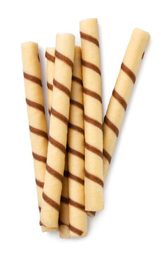 Pile of wafer rolls close-up on a white background. Top view