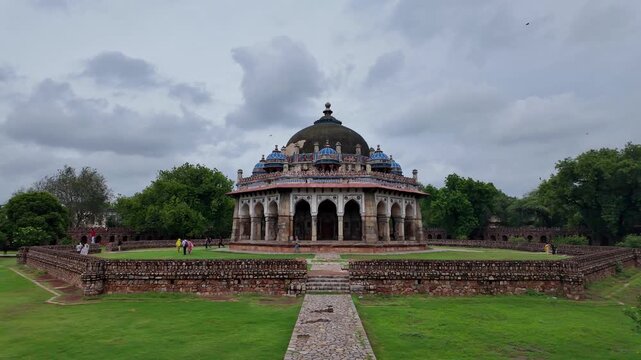 Delhi, India : Panoramic footage from the garden of the tomb of Isa Khan, mausoleum built between 1547 and 1548 located within the Humayun's Tomb complex in Delhi, India under cloudy sky