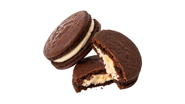 Fresh round cookies with chocolate filling halves isolated on transparent background.