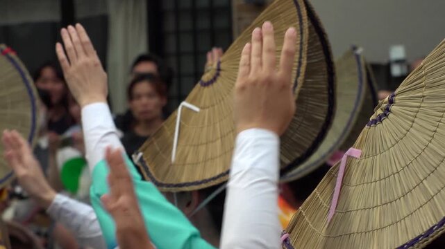 TOKYO, JAPAN - AUG 2026 : Slow motion shot of Awa Odori dance festival in Koenji. Powerful and energetic dance and music. Traditional Japanese summer event in Tokyo. Close up shot of lady dancer.