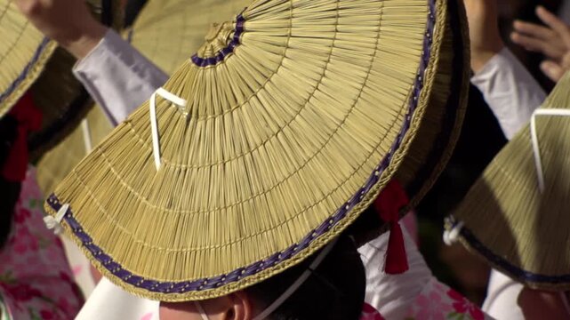 TOKYO, JAPAN - AUG 2026 : Slow motion shot of Awa Odori dance festival in Koenji. Powerful and energetic dance and music. Traditional Japanese summer event in Tokyo. Close up shot of lady dancer.