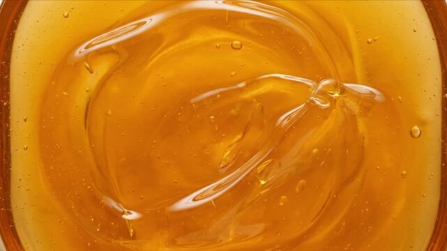 ミツバチの巣蜜の六角形セルへズームインし濃厚な蜂蜜が広がるマクロ3D映像