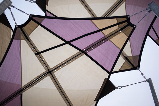 Geometric shade sail canopy with translucent fabric panels