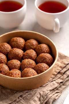Traditional Kazakh sweet dessert irimshik balls made of boiled curd served in craft bowl