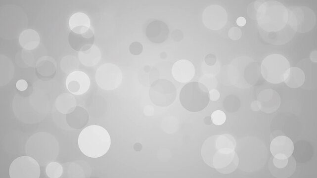 A high-resolution abstract animation featuring floating gray and white bubbles with organic movement and pulsating effects.