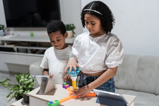 Children learning and playing with educational toy at home