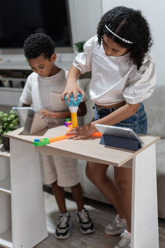 Children balancing screen time and physical play indoors